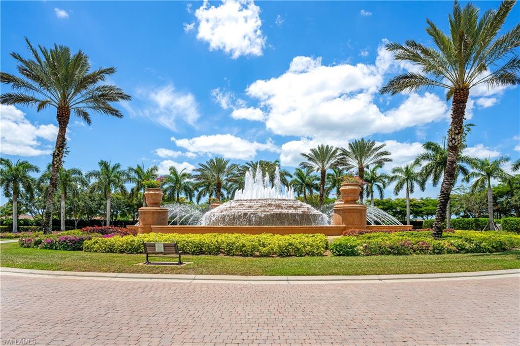 9259 Museo Circle, Unit 7102 Naples, FL 34114 - Photo 20 of 41 a view of a fountain in front of a house with a yard