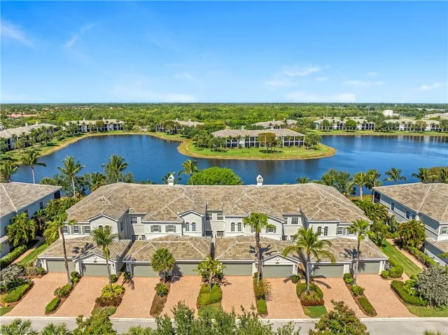 an aerial view of a house with lake view