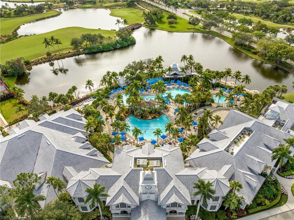 9259 Museo Circle, Unit 7102 Naples, FL 34114 - Photo 22 of 41 an aerial view of residential houses with outdoor space and lake view