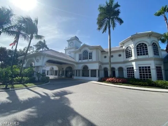 a front view of multiple houses with yard