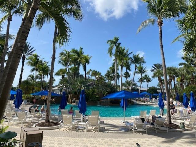 9259 Museo Circle, Unit 7102 Naples, FL 34114 - Photo 26 of 41 a view of a street with a palm tree