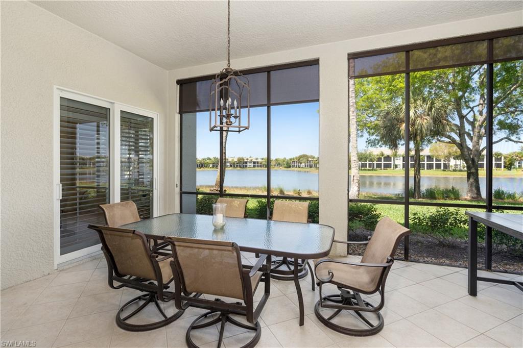 9259 Museo Circle, Unit 7102 Naples, FL 34114 - Photo 6 of 41 a view of a dining room with furniture window and outside view