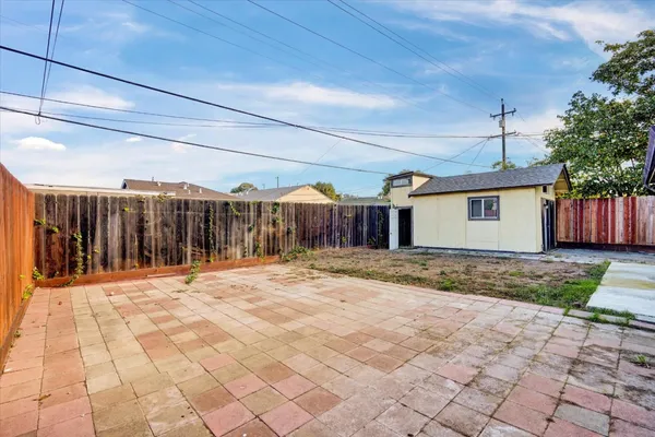 a view of a backyard of the house