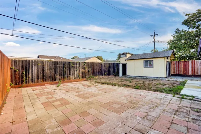 a view of a backyard of the house