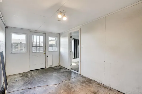 an empty room with windows