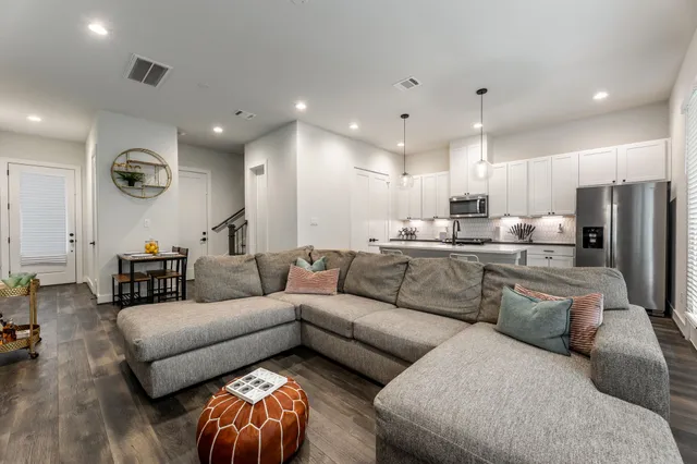 a living room with furniture and a large window