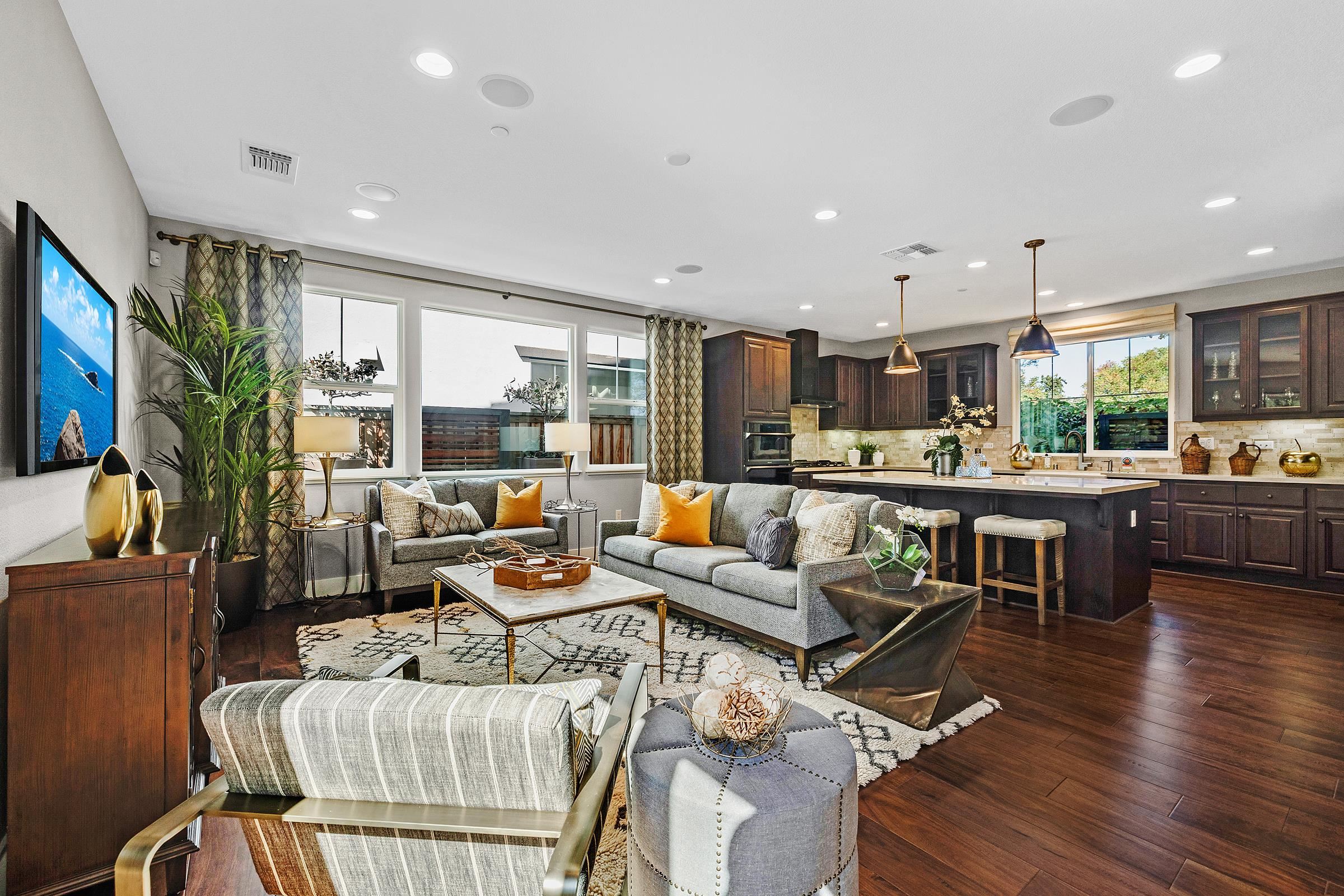 883 Barney Common Livermore, CA 94551 - Photo 12 of 38 a living room with lots of furniture kitchen view and a large window