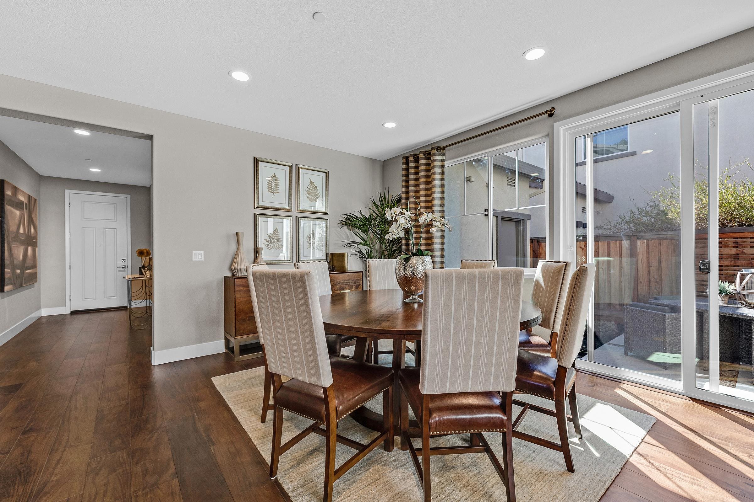 883 Barney Common Livermore, CA 94551 - Photo 15 of 38 a dining room with furniture window and wooden floor