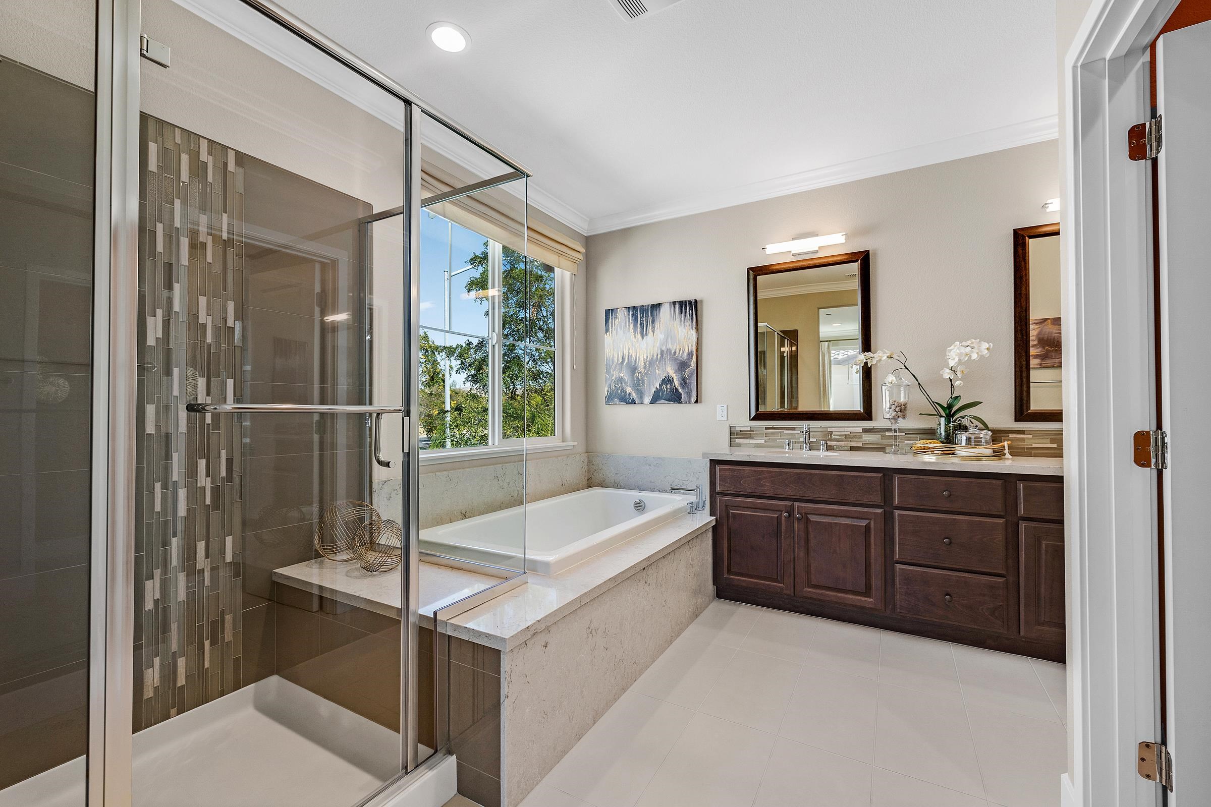 883 Barney Common Livermore, CA 94551 - Photo 25 of 38 a bathroom with a tub a sink and mirror