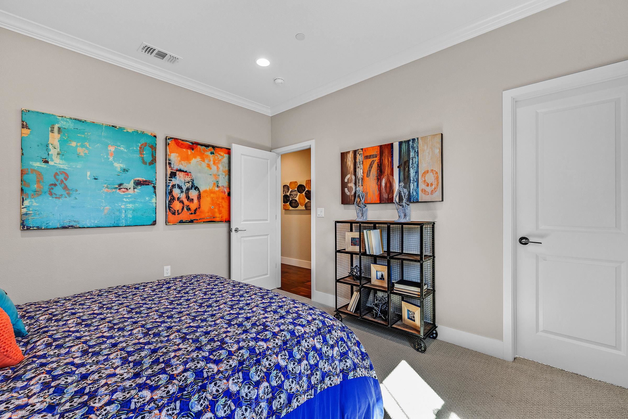 883 Barney Common Livermore, CA 94551 - Photo 30 of 38 a bedroom with a bed and a book shelf