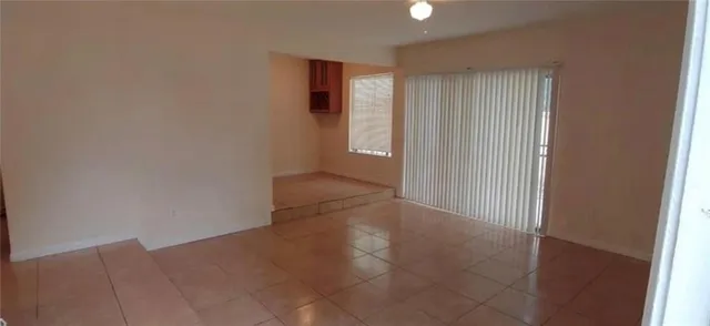 a view of an empty room and window
