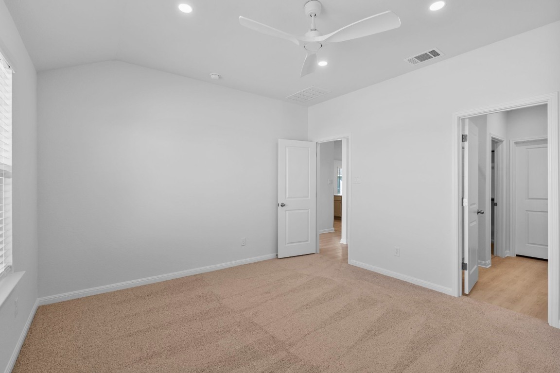 129 Hatari Trail Jarrell, TX 76537 - Photo 24 of 33 an empty room with an entryway and fan