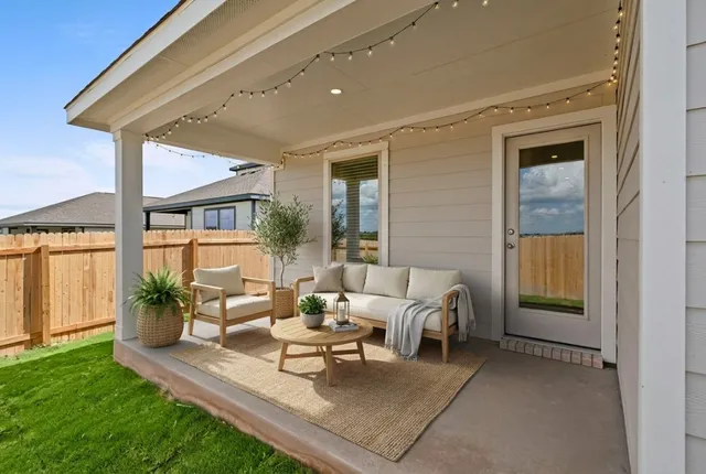 a outdoor living space with furniture and a potted plant