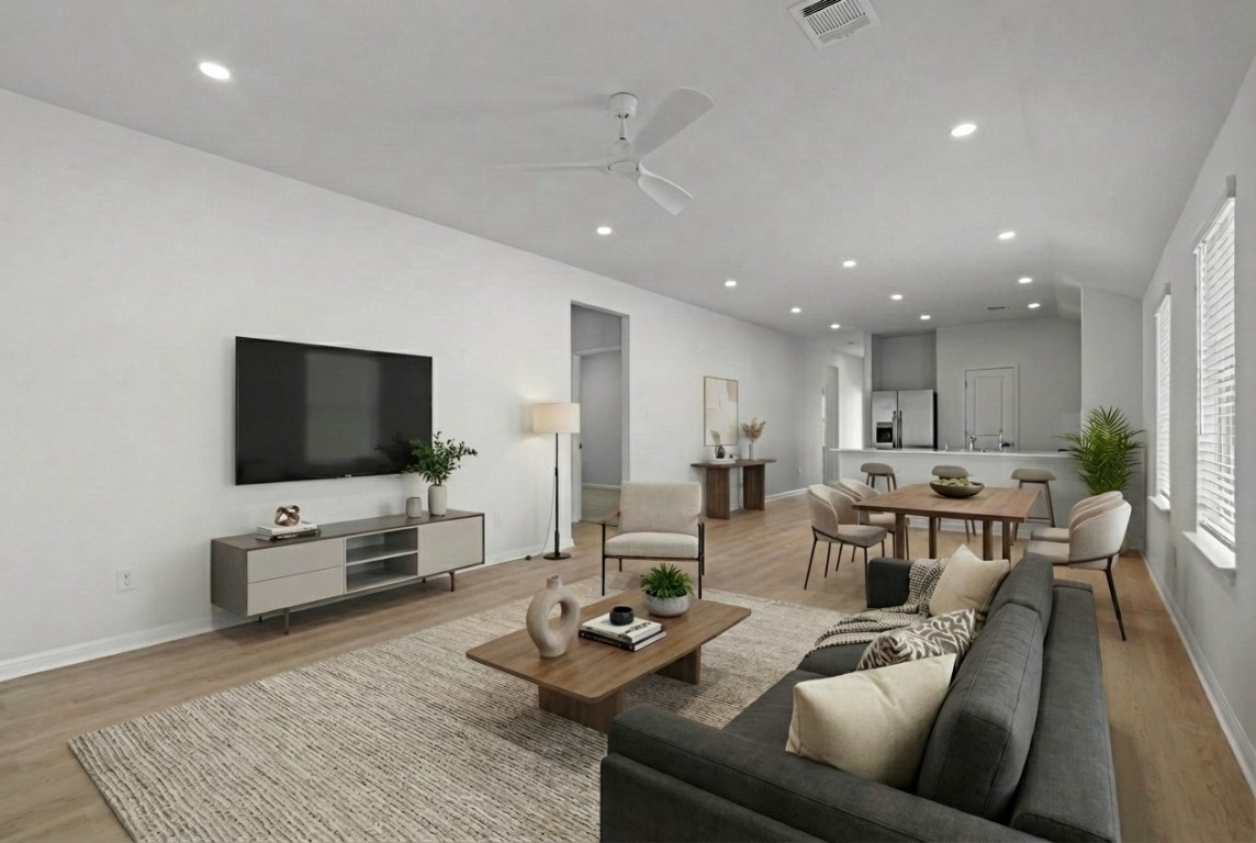 129 Hatari Trail Jarrell, TX 76537 - Photo 3 of 33 a living room with furniture and a flat screen tv