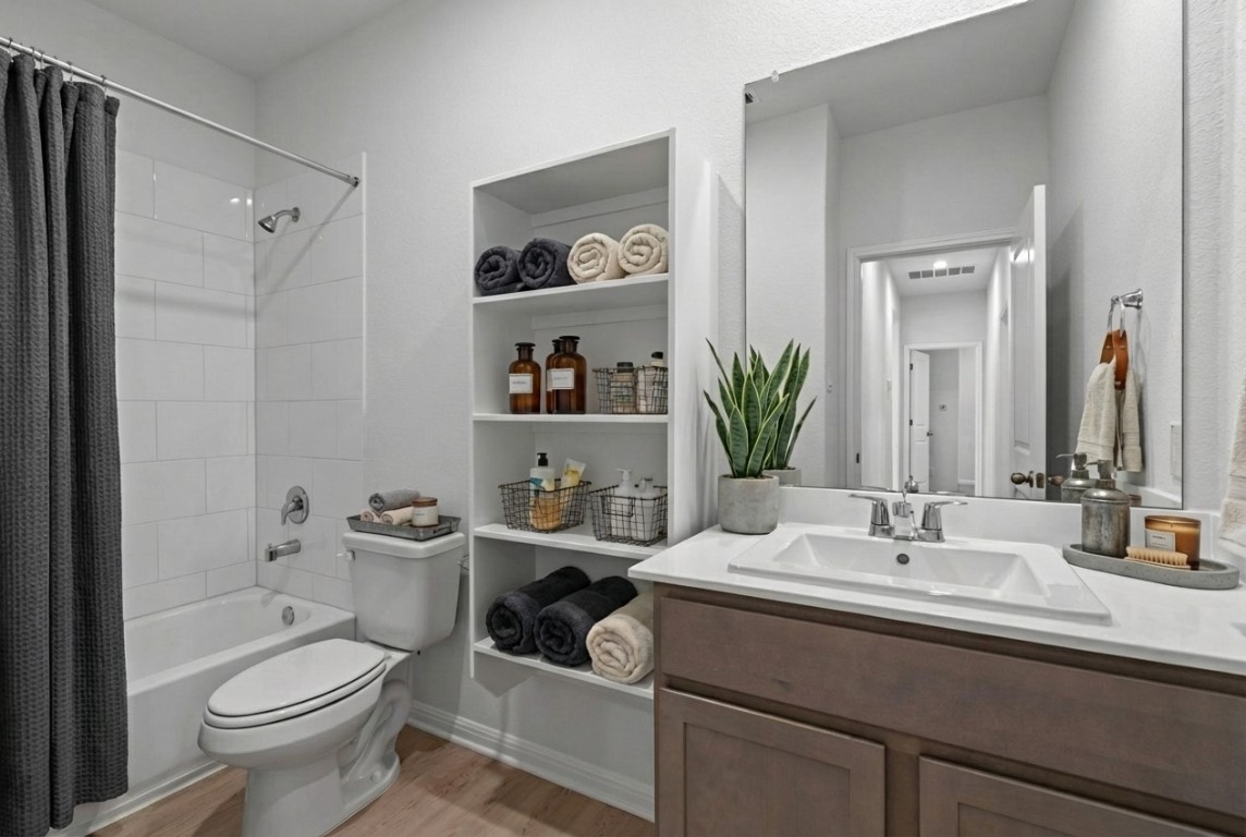 129 Hatari Trail Jarrell, TX 76537 - Photo 5 of 33 a bathroom with a sink toilet and shower