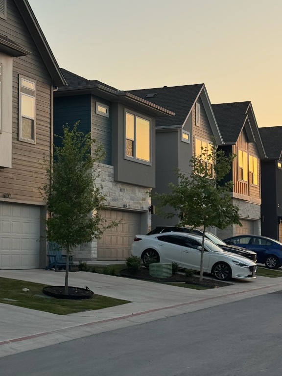 609 Terrier Trail Austin, TX 78745 - Photo 21 of 26 a car parked in front of a house