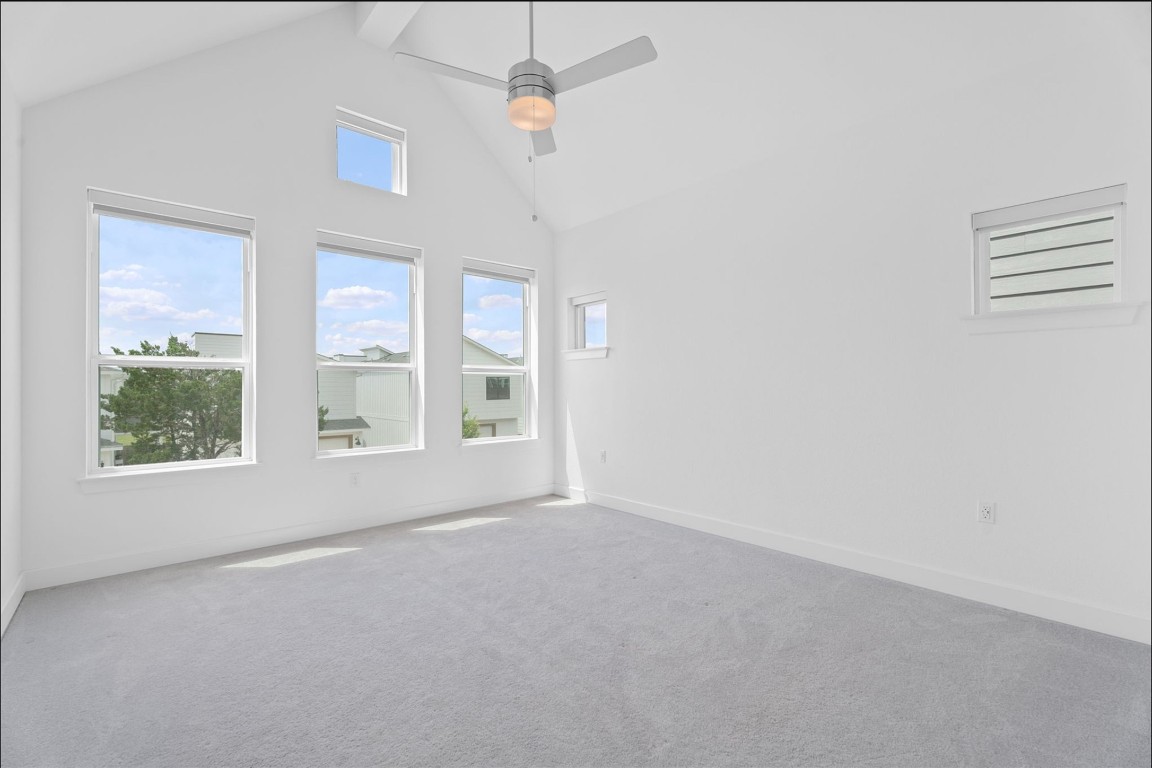 609 Terrier Trail Austin, TX 78745 - Photo 7 of 26 an empty room with windows and closet