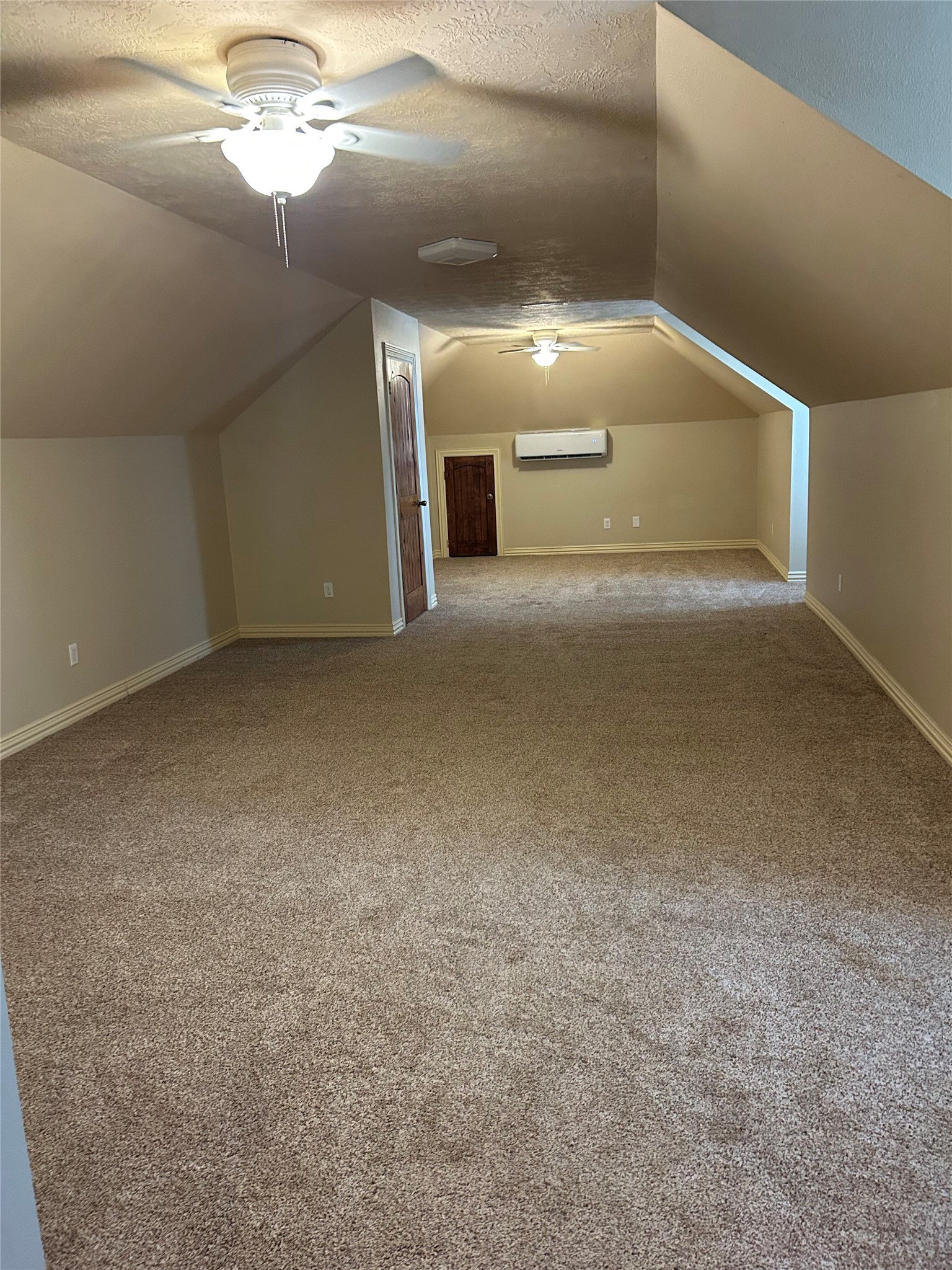 329 Flash Circle Luling, TX 78648 - Photo 24 of 32 Angled ceilings and soft carpeting define this versatile upper-level bonus space.