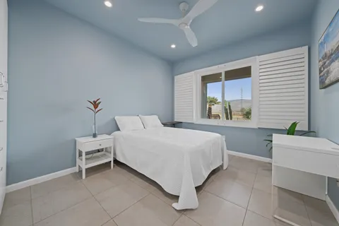 a bedroom with a bed and a table
