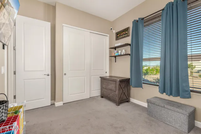 a spacious bathroom with a double vanity sink a mirror and a shower