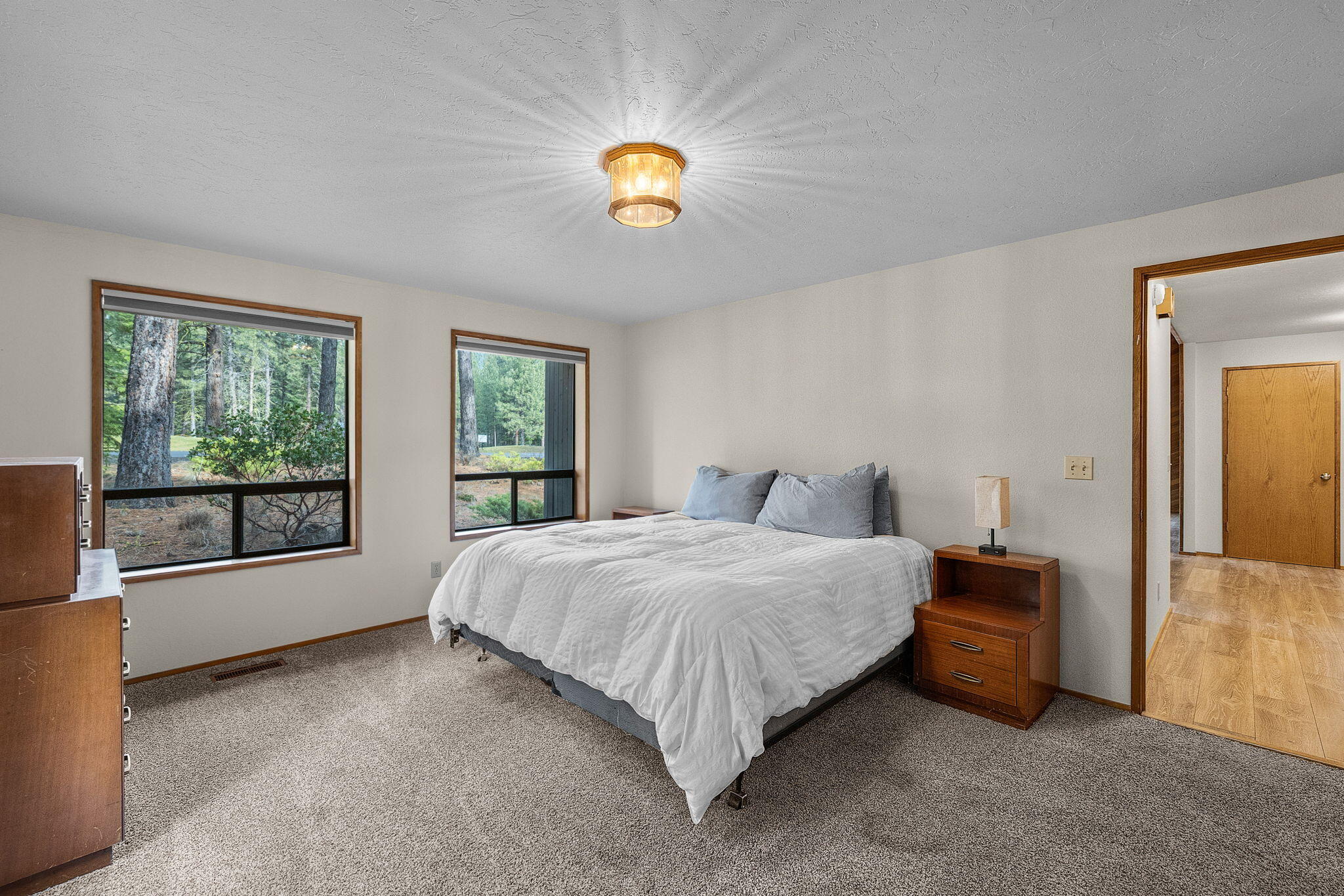 13168 Hawks Beard Black Butte Ranch, OR 97759 - Photo 12 of 47 a bedroom with a bed and a window