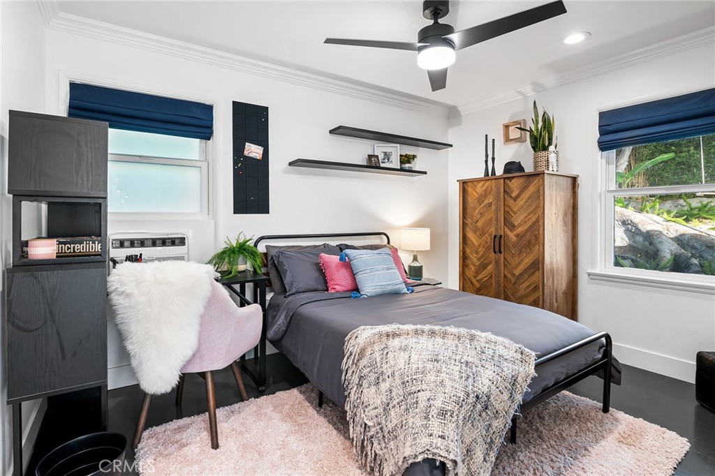 736 Griffith Place Laguna Beach, CA 92651 - Photo 18 of 24 a bedroom with a bed mirror and window