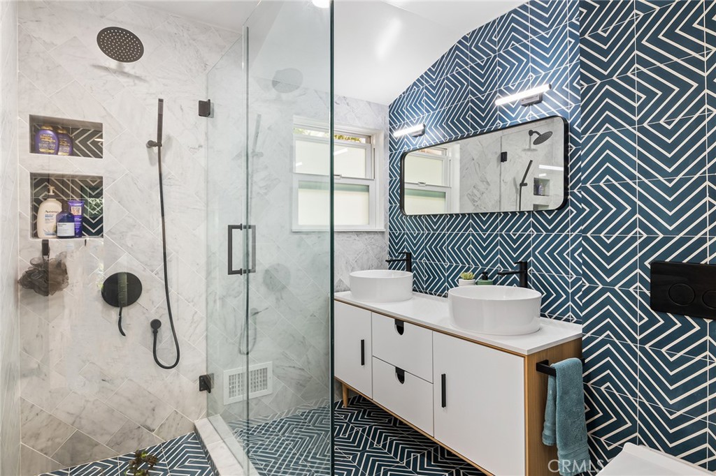 736 Griffith Place Laguna Beach, CA 92651 - Photo 20 of 24 a bathroom with a sink toilet and shower