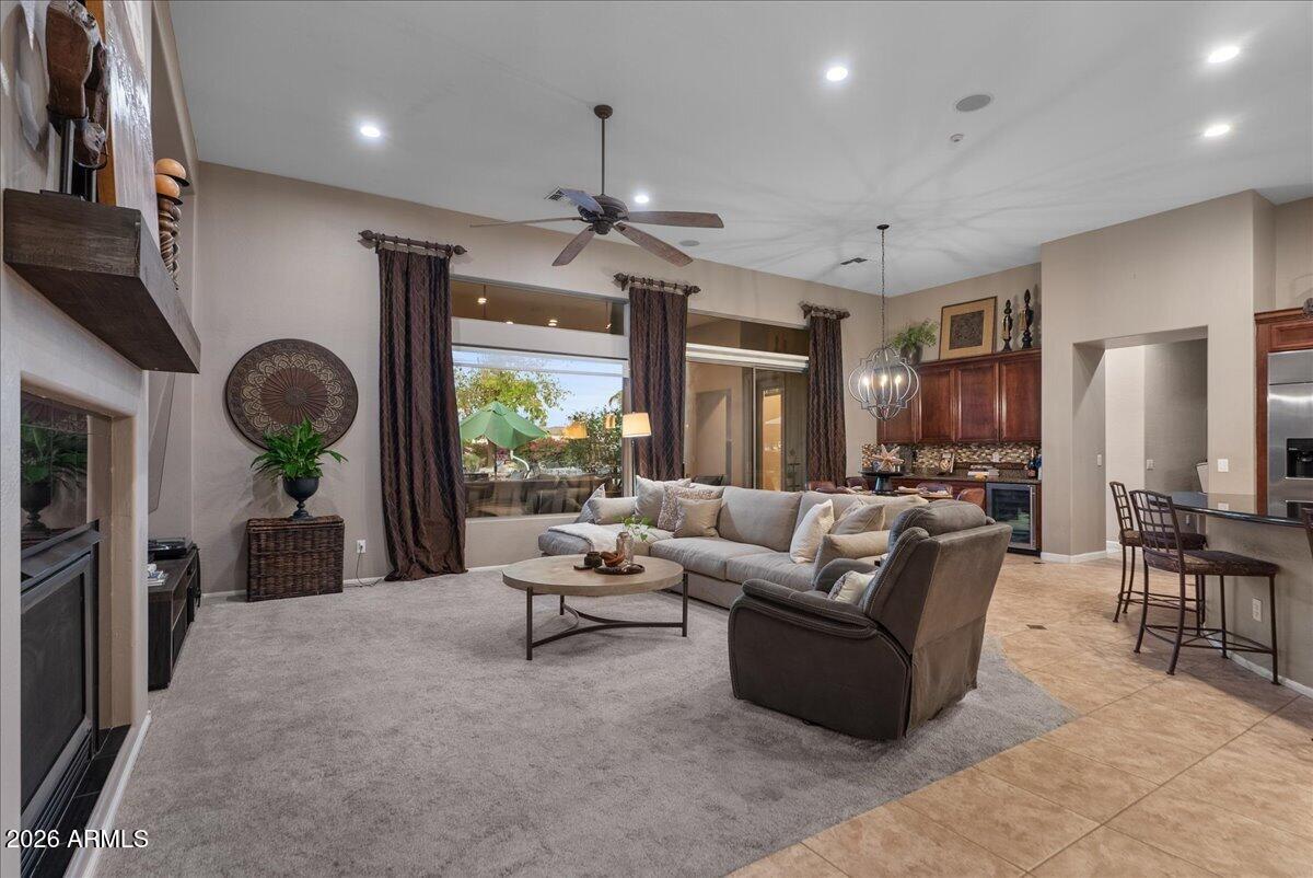 6427 South Magic Court Gilbert, AZ 85298 - Photo 24 of 71 a living room with furniture and a large window