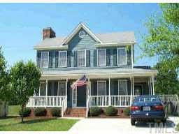 4308 Warfield Place Raleigh, NC 27604 - Photo 1 of 1 a front view of a house with a garden