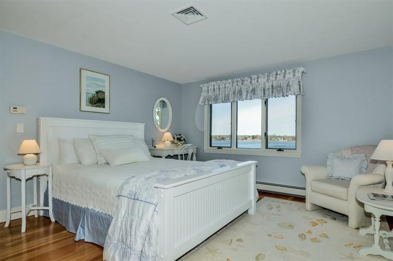 46 Gibson Road Orleans, MA 02653 - Photo 11 of 22 a bedroom with a bed and a table