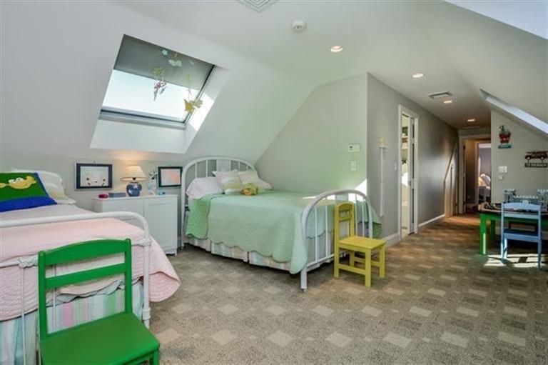 46 Gibson Road Orleans, MA 02653 - Photo 12 of 22 a bedroom with a bed and a chandelier