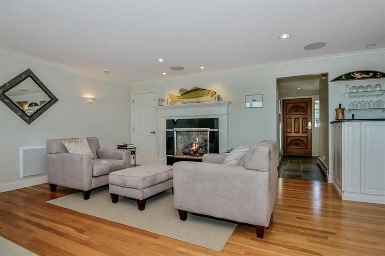 46 Gibson Road Orleans, MA 02653 - Photo 5 of 22 a living room with furniture and a fireplace