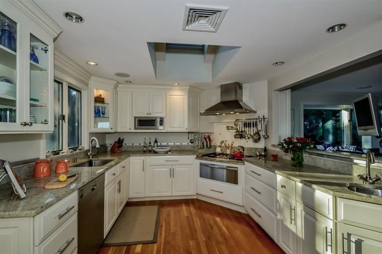 46 Gibson Road Orleans, MA 02653 - Photo 6 of 22 a kitchen with stainless steel appliances a sink stove and cabinets