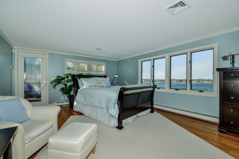 46 Gibson Road Orleans, MA 02653 - Photo 9 of 22 a bedroom with a bed and large window