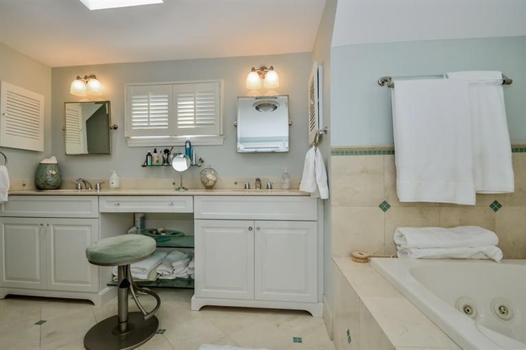 46 Gibson Road Orleans, MA 02653 - Photo 10 of 22 a bathroom with a sink double vanity and a mirror