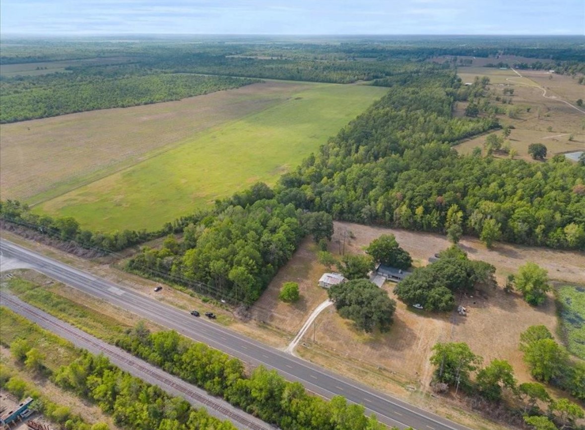 0 Us-90 Liberty, TX 77575 - Photo 4 of 7 a view of a lake from a yard