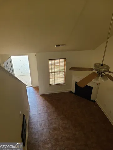 a view of a big room with windows