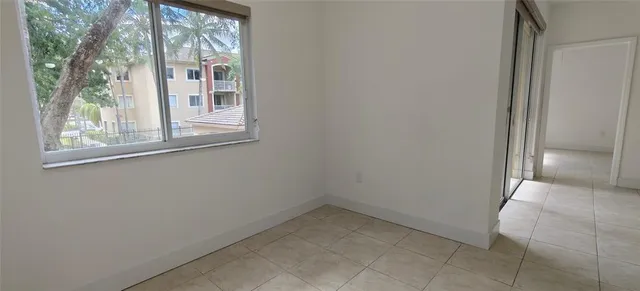 a kitchen with cabinets and steel appliances
