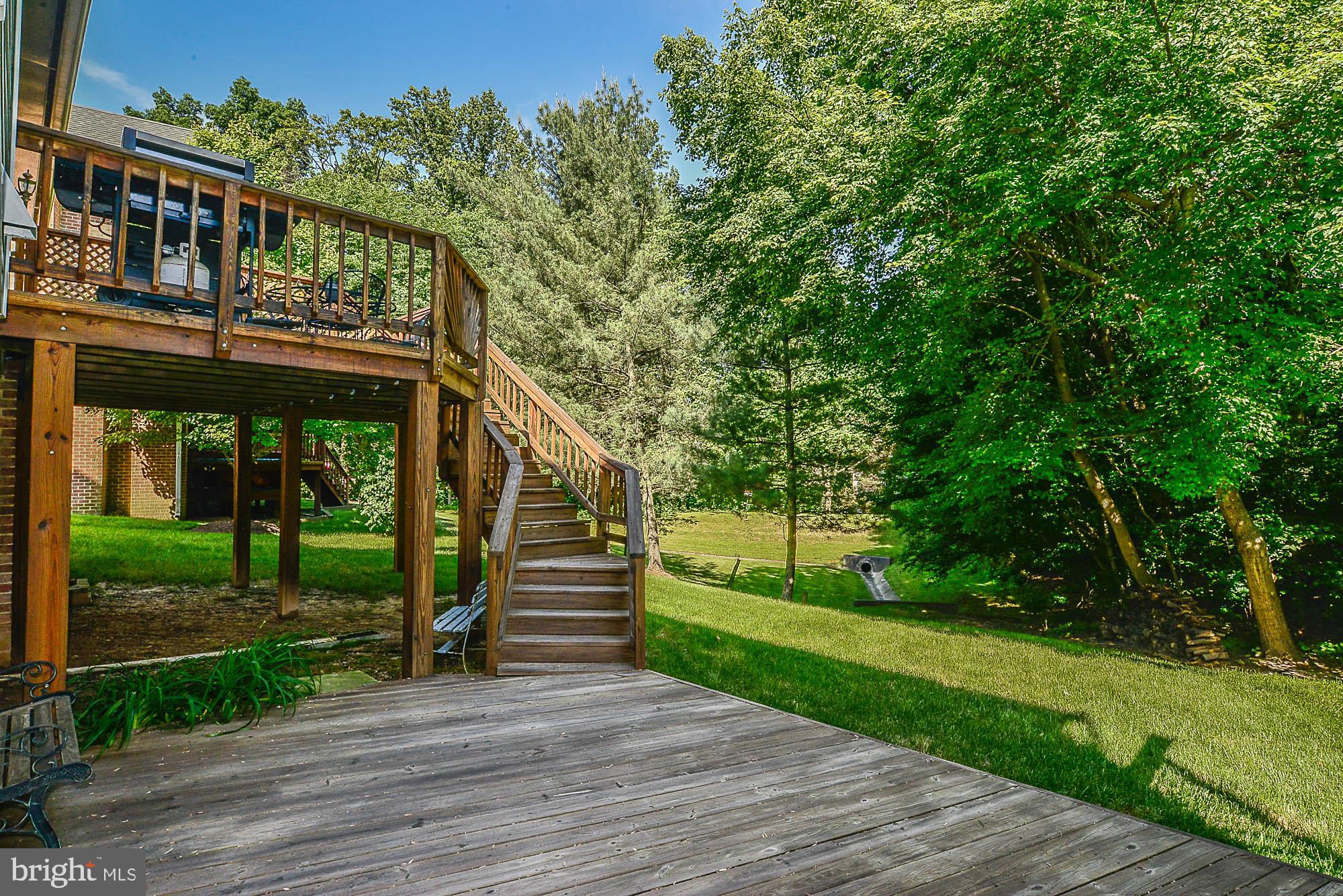 4412 Nuttall Road Fairfax, VA 22032 - Photo 31 of 32 Lower level deck in a park-like setting
