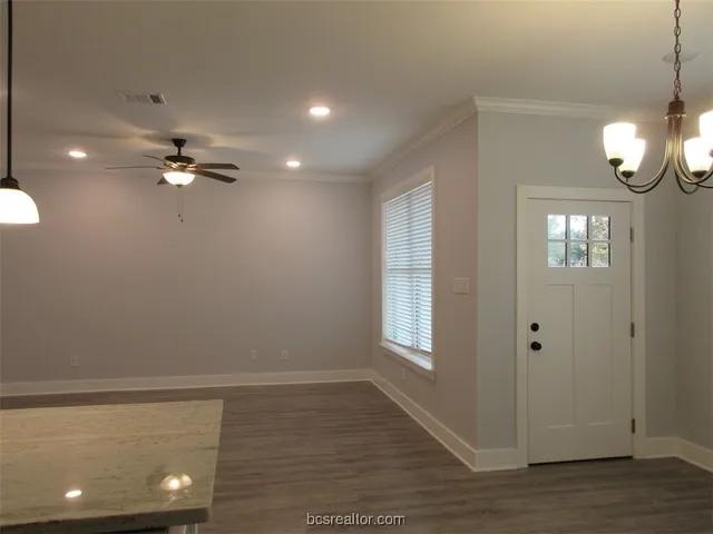 a view of an empty room with a window
