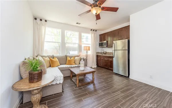 a living room with furniture and a window