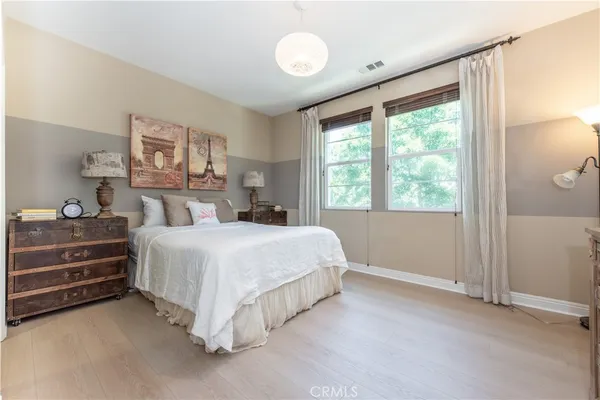 a bed room with a bed and a window