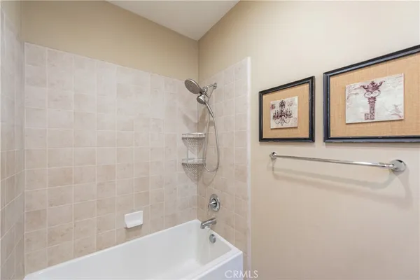 a bathroom with a bathtub and shower