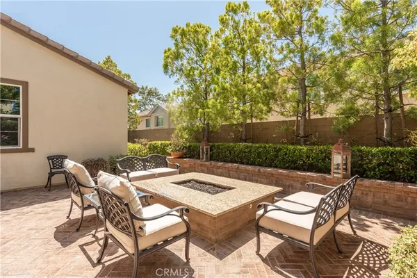 a view of a patio with table and chairs and potted plants