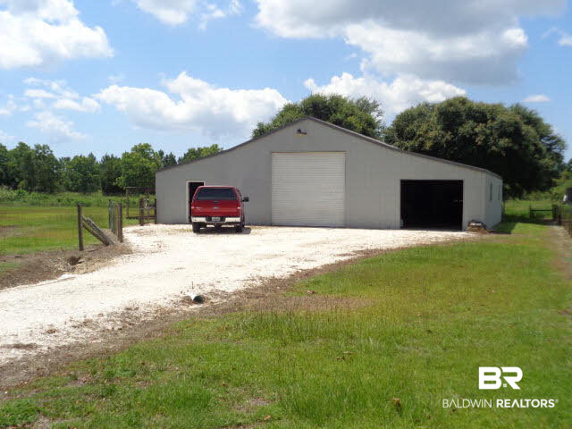 28202 Vargo Lane Elberta, AL 36530 - Photo 35 of 45 48 x 49 metal building!!!! Has water and electric.Perfect for many uses: car, RV repair shop, lawn business, farm equipment. USE YOUR IMAGINATION!!!! So many possibilities!!!!