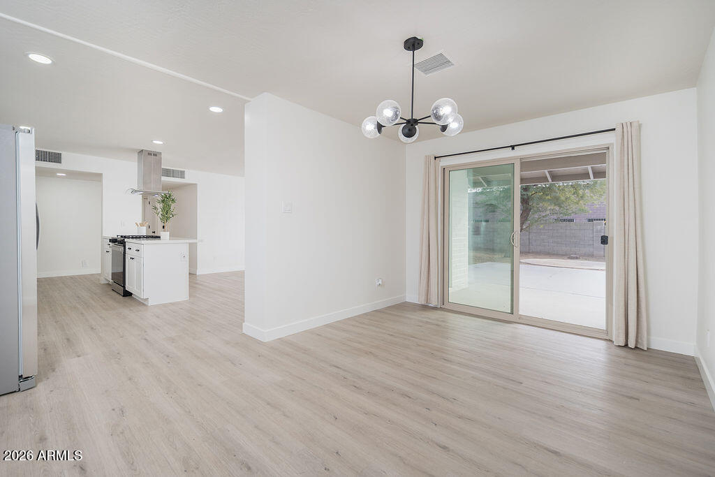 4653 East Almeria Road Phoenix, AZ 85008 - Photo 8 of 18 a view of an empty room with a window