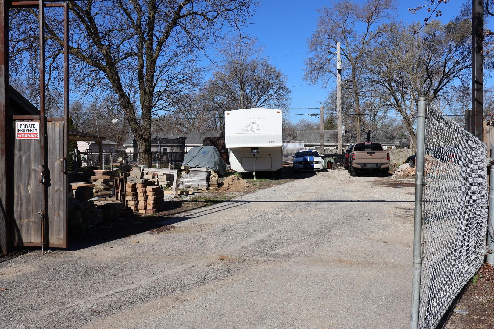 a view of a street with a large tree