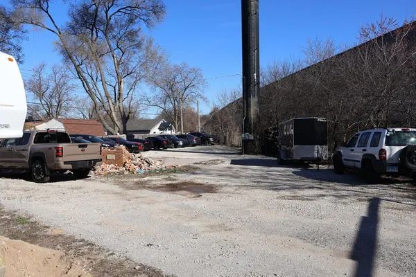 a view of street with parked cars