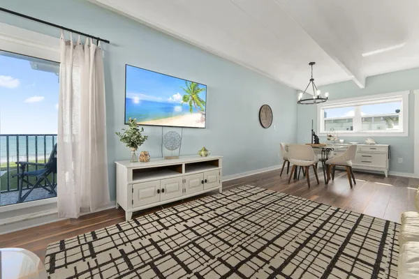 a kitchen with stainless steel appliances granite countertop white cabinets a sink and a stove