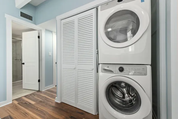 a view of a swimming pool with outdoor seating and a buildings